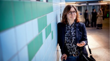 Woman listening to something in her smartphone